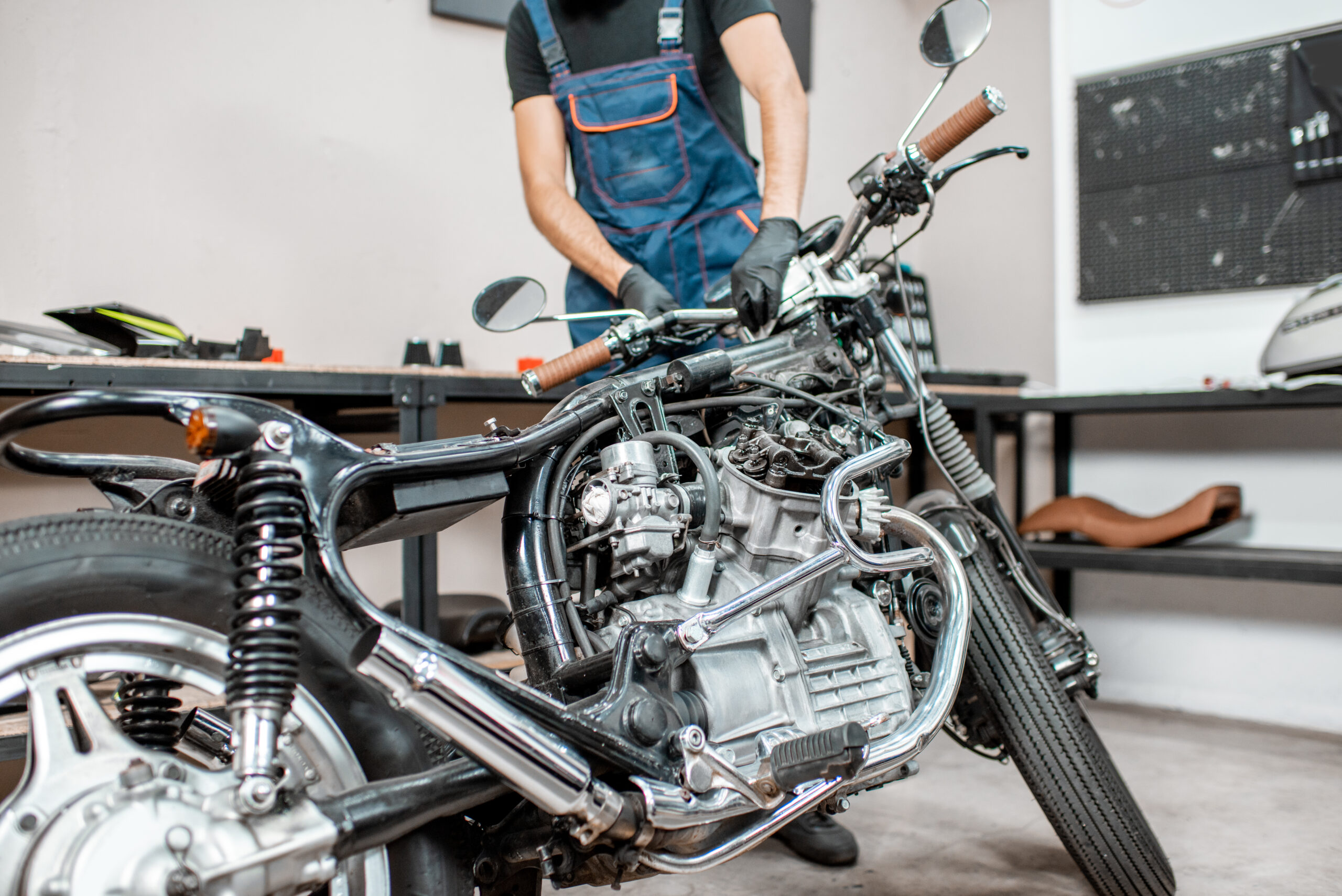 Repairing motorcycle in the workshop